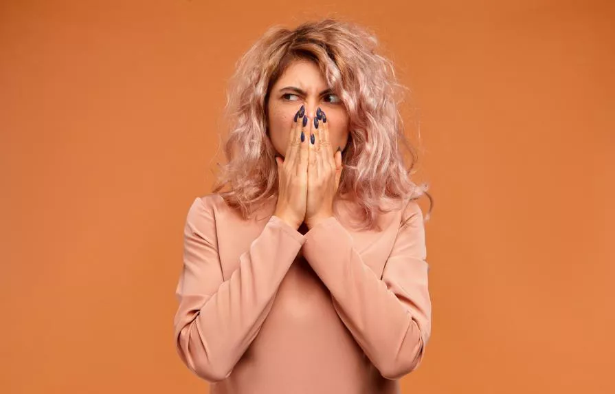 picture-of-grimacing-displeased-disgusted-young-woman-with-stylish-hairdo-pinching-nose-because-of-unpleasant-smell-coming-from-rotten-food-in-fridge-stink-disgust_15465513_20201229185408-focus-0.01-0.56-895-573